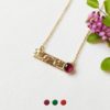 Handmade-gold-plated-short-necklace-for-women-with-a-garnet-gemstone-made-in-France