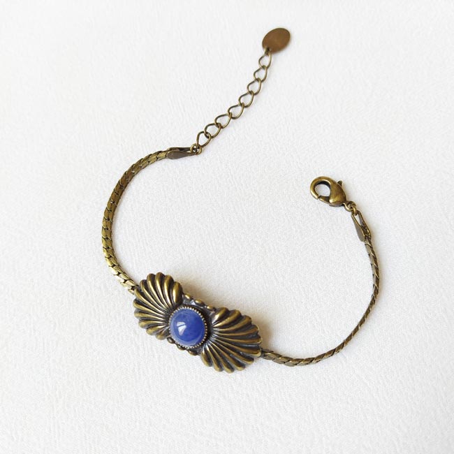 Handmade-antique-brass-bracelet-for-women-with-a-seashell-with-a-blue-gemstone-made-in-Paris-France