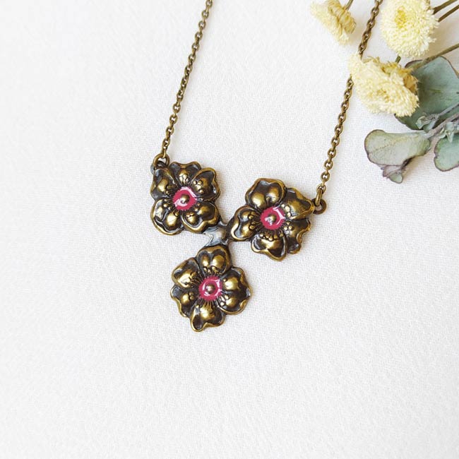 Handmade-antique-brass-necklace-for-women-with-a-plum-flower-made-in-Paris