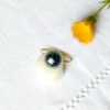 Bague-réglable-de-créateur-fantaisie-artisanal-or-pour-femme-avec-perle-en-céramique-noir-fait-main-en-Gironde-France